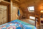 Bedroom in the cabin house with a queen bed.